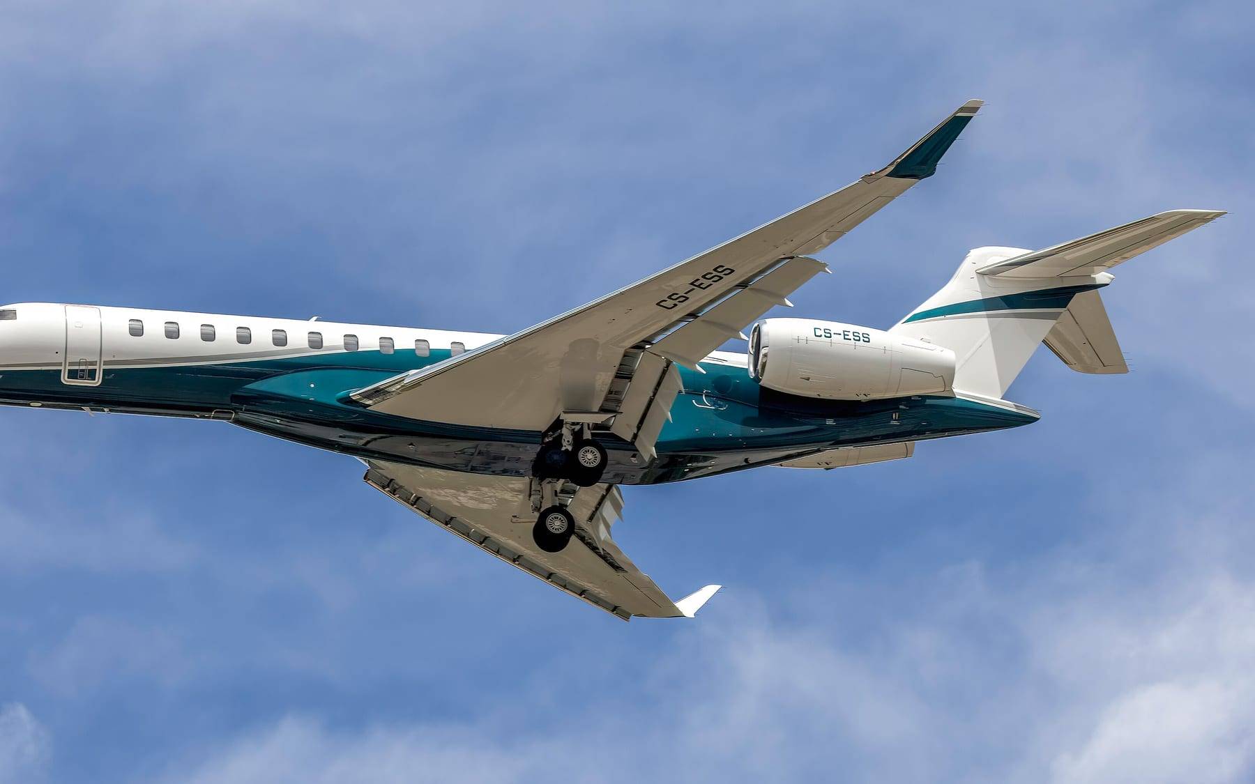 A Bombardier Global 7500 in flight with its landing gear extended