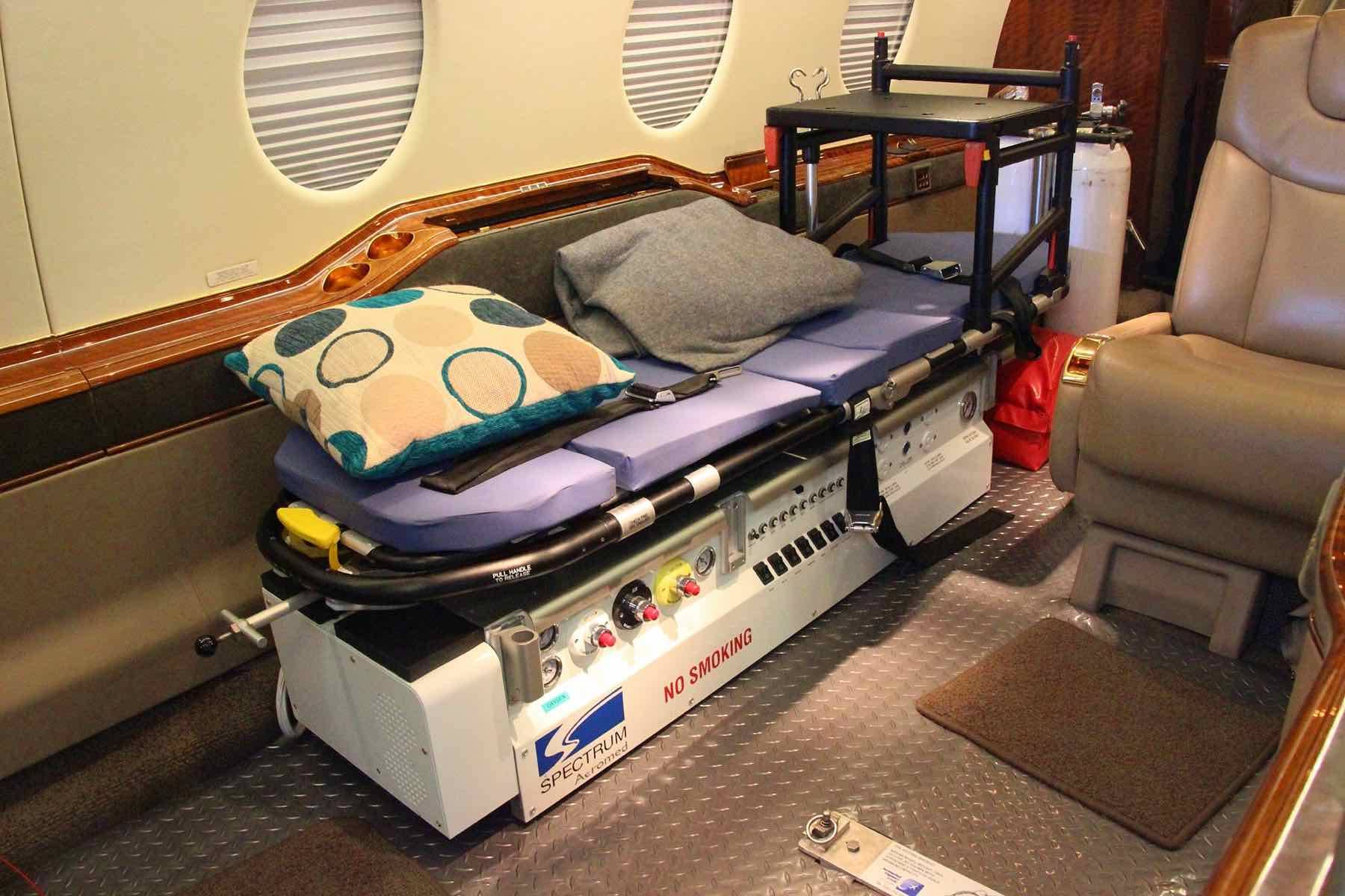 The cabin of a business jet fitted out as an air ambulance, with a stretcher installed
