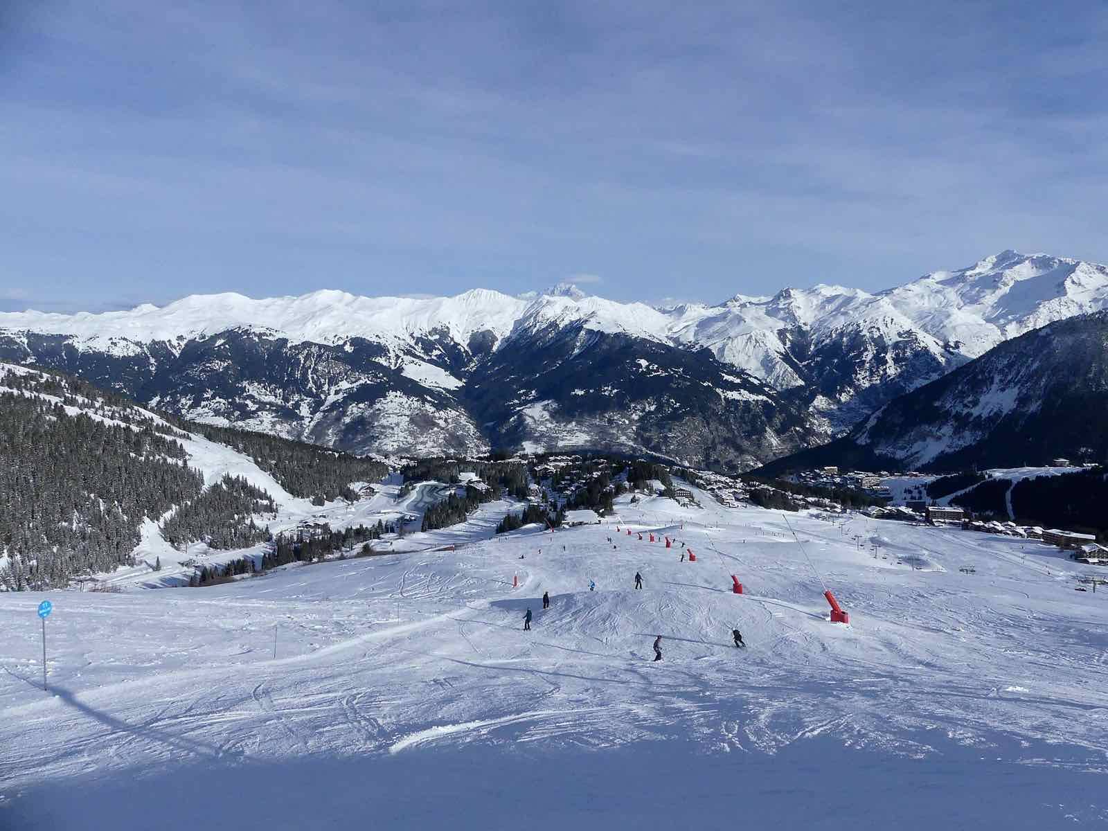 Sight of Biollay ski slope going down to Courchevel 1850 resort village, in Savoie, France